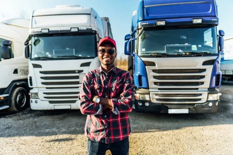 a man in front of trucka- Truck driver jobs in USA with visa sponsorship